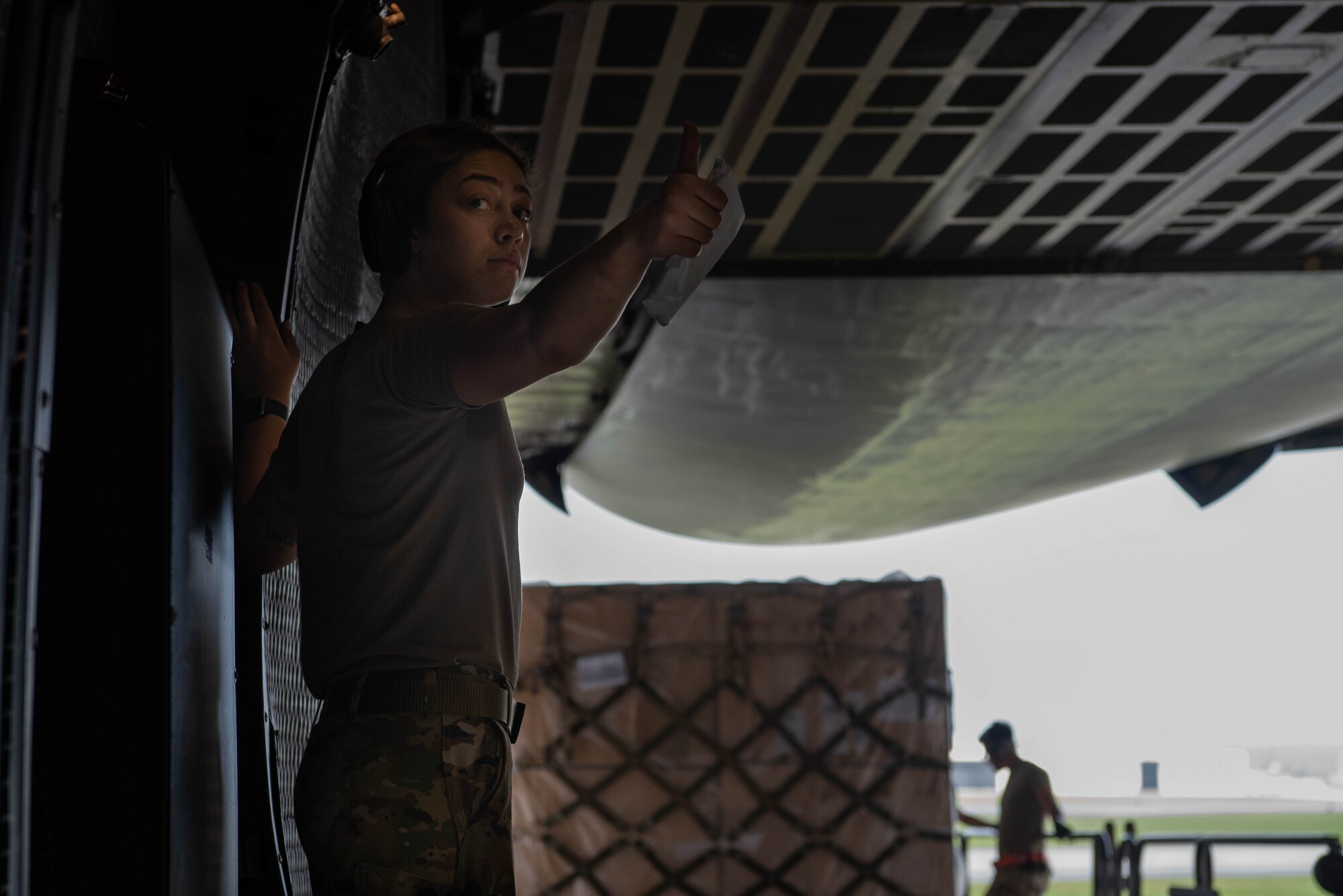 An Airman gives a thumbs up for cargo to be loaded.