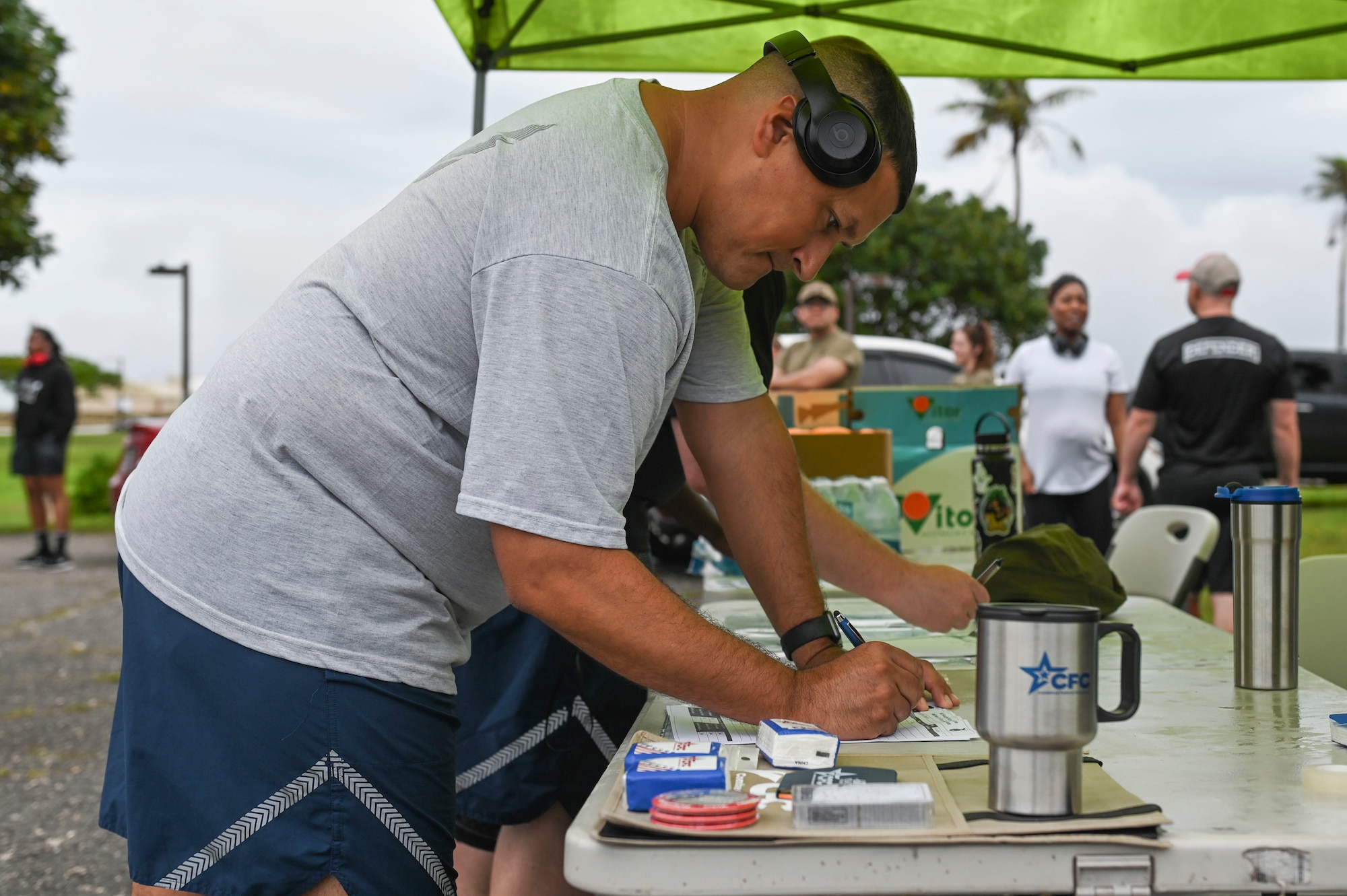 Airman writing on a piece of paper.