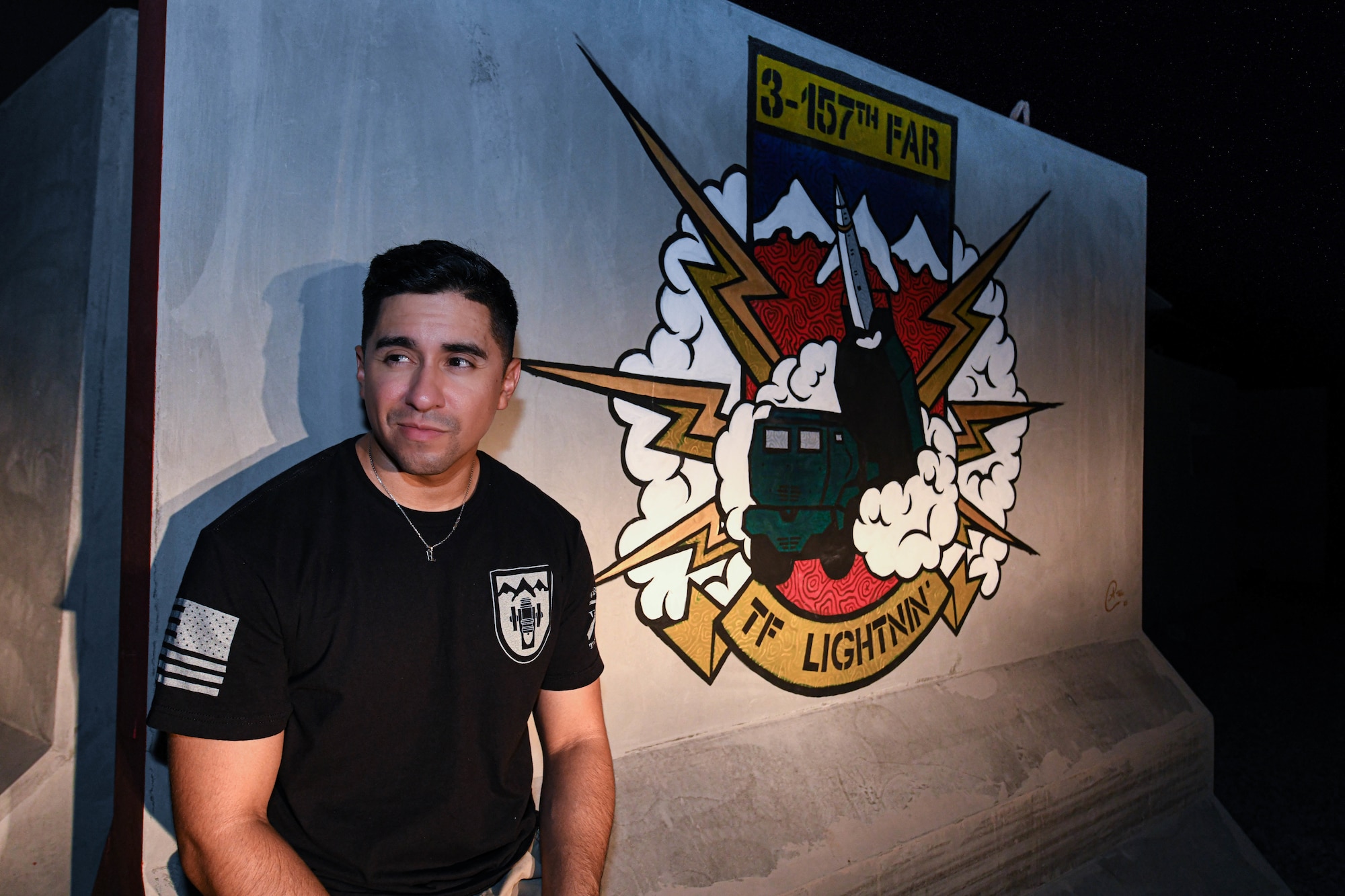 U.S. Army Sgt. Anthony Castillo, a mobility specialist assigned to the 3-157th Field Artillery unit and Colorado National Guardsmen, paints ten murals across Al Dhafra Air Base.