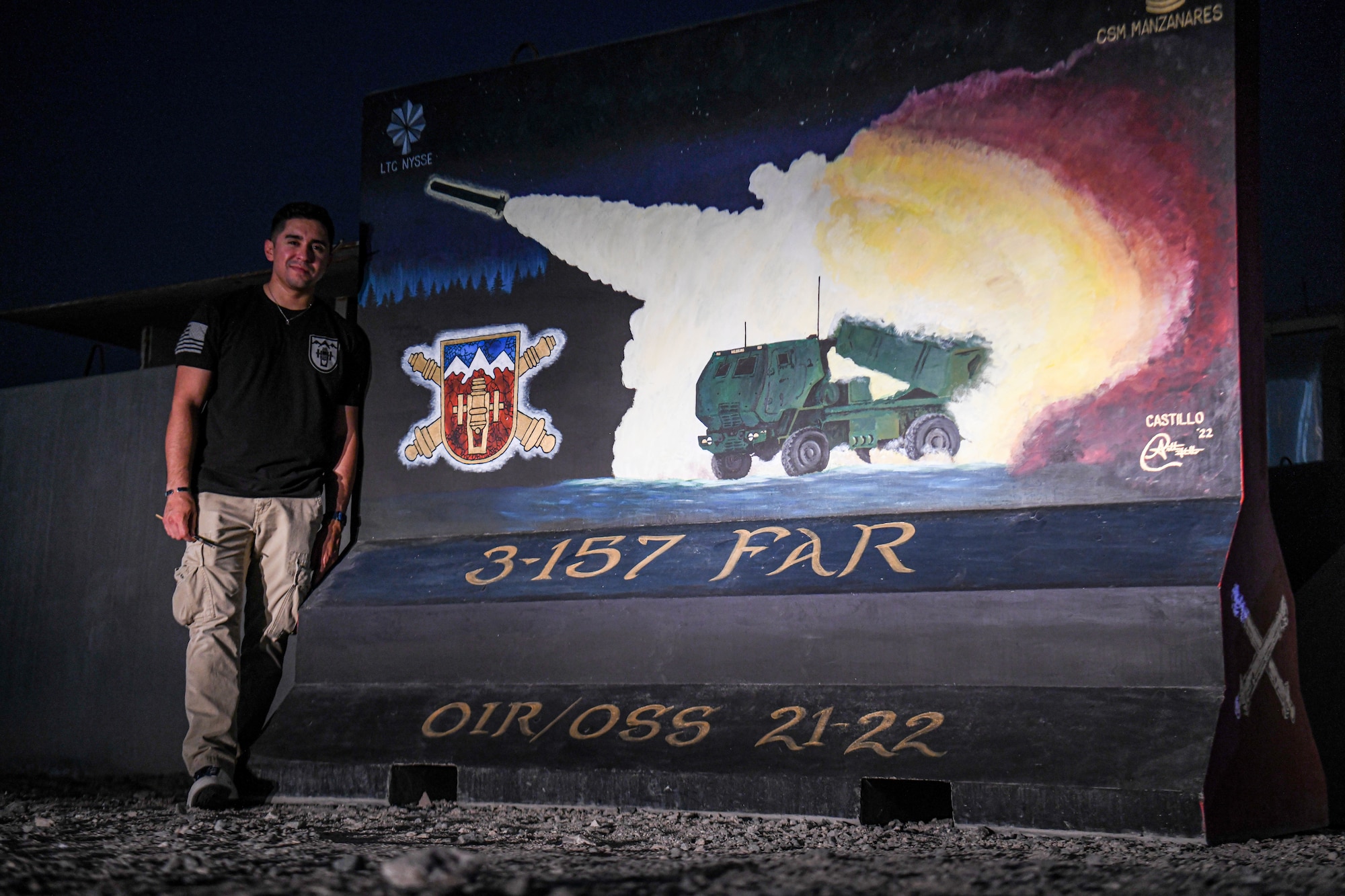 U.S. Army Sgt. Anthony Castillo, a mobility specialist assigned to the 3-157th Field Artillery unit and Colorado National Guardsmen, paints ten murals across Al Dhafra Air Base.