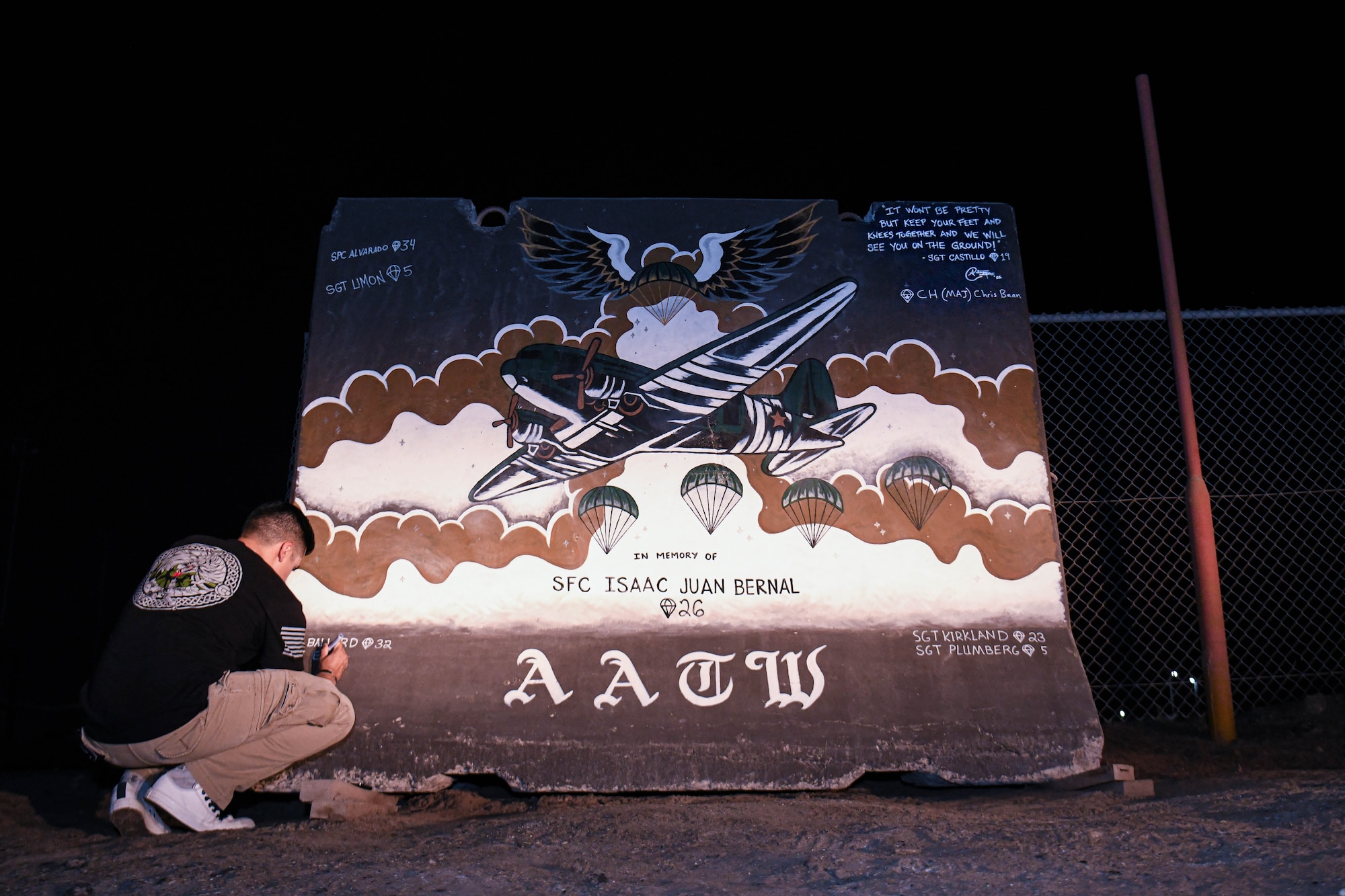 U.S. Army Sgt. Anthony Castillo, a mobility specialist assigned to the 3-157th Field Artillery unit and Colorado National Guardsmen, paints ten murals across Al Dhafra Air Base.