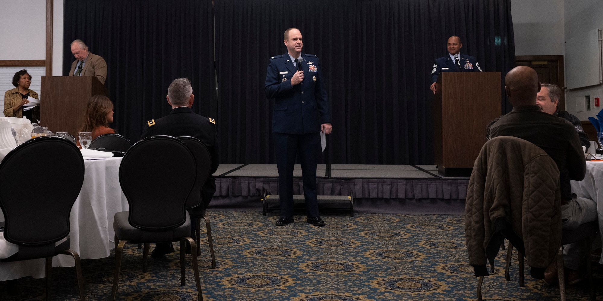 U.S. Air Col. Denny Davies, 86th Airlift Wing Vice Commander, speaks to a crowd at the Retiree Appreciation Day event at Ramstein Air Base, Germany, Oct. 13, 2022. Davies spoke about important information pertaining to retirees and how it will shape the Kaiserslautern Military Community in the future. (U.S. Air Force photo by Senior Airman Thomas Karol)