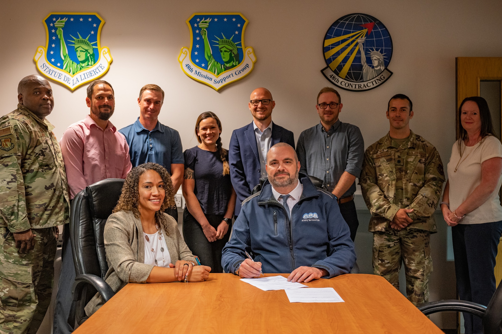 Members of the 48th Contracting Squadron at the signing of the first Simplified Acquisition of Base Engineer (SABER) Contract for a base within the United Kingdom at Royal Air Force Lakenheath, Sep 1, 2022. The SABER contract allows the 48th CONS to quickly evaluate and fulfill construction contracts. (U.S. Air Force photo by Staff Sgt. John Ennis)