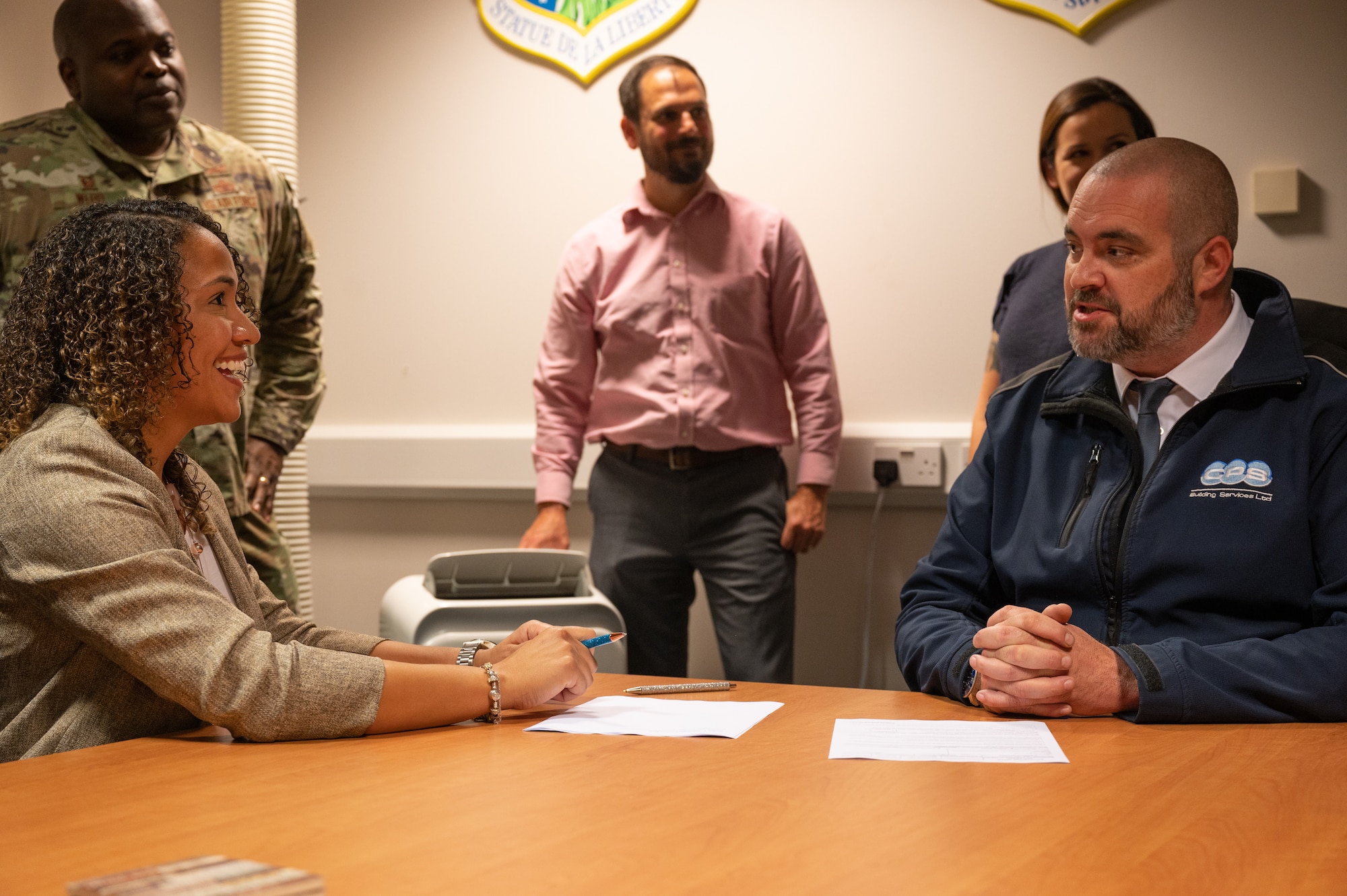 Members of the 48th Contracting Squadron at the signing of the first Simplified Acquisition of Base Engineer (SABER) Contract for a base within the United Kingdom at Royal Air Force Lakenheath, Sep 1, 2022. The SABER contract allows the 48th CONS to quickly evaluate and fulfill construction contracts. (U.S. Air Force photo by Staff Sgt. John Ennis)