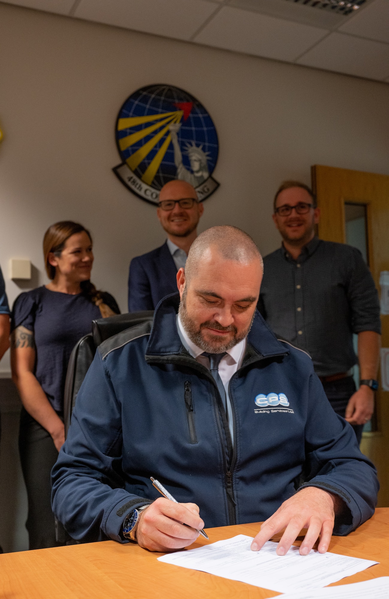 Members of the 48th Contracting Squadron at the signing of the first Simplified Acquisition of Base Engineer (SABER) Contract for a base within the United Kingdom at Royal Air Force Lakenheath, Sep 1, 2022. The SABER contract allows the 48th CONS to quickly evaluate and fulfill construction contracts. (U.S. Air Force photo by Staff Sgt. John Ennis)