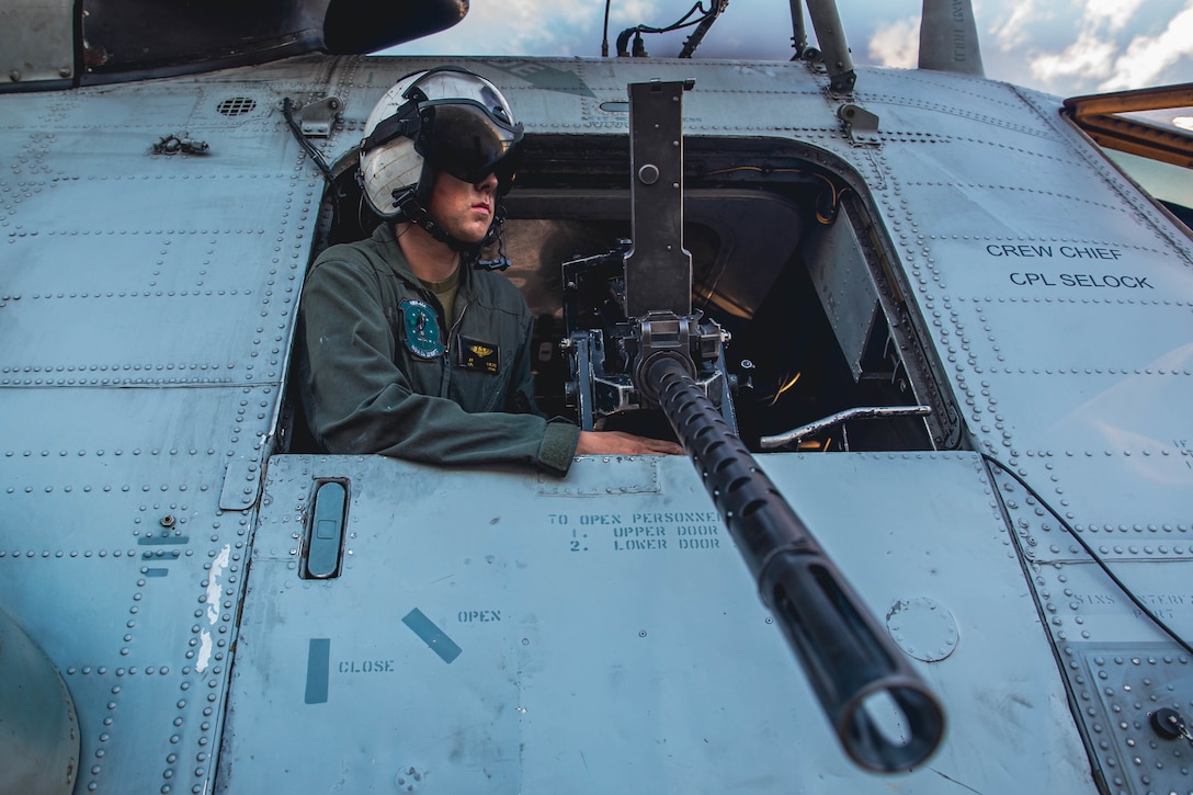 U.S. Marine Corps Cpl. Aaron Lucas, a CH-53E Super Stallion crew chief with Marine Heavy Helicopter Squadron 464, supervises maintenance at an undisclosed location, Oct. 11, 2022. HMH-464 provided assault support for Marine Forces Special Operations Command during Exercise Raven 23-1 to enhance combat readiness in an unfamiliar expeditionary environment. HMH-464 is a subordinate unit of 2nd Marine Aircraft Wing, the aviation combat element of II Marine Expeditionary Force.