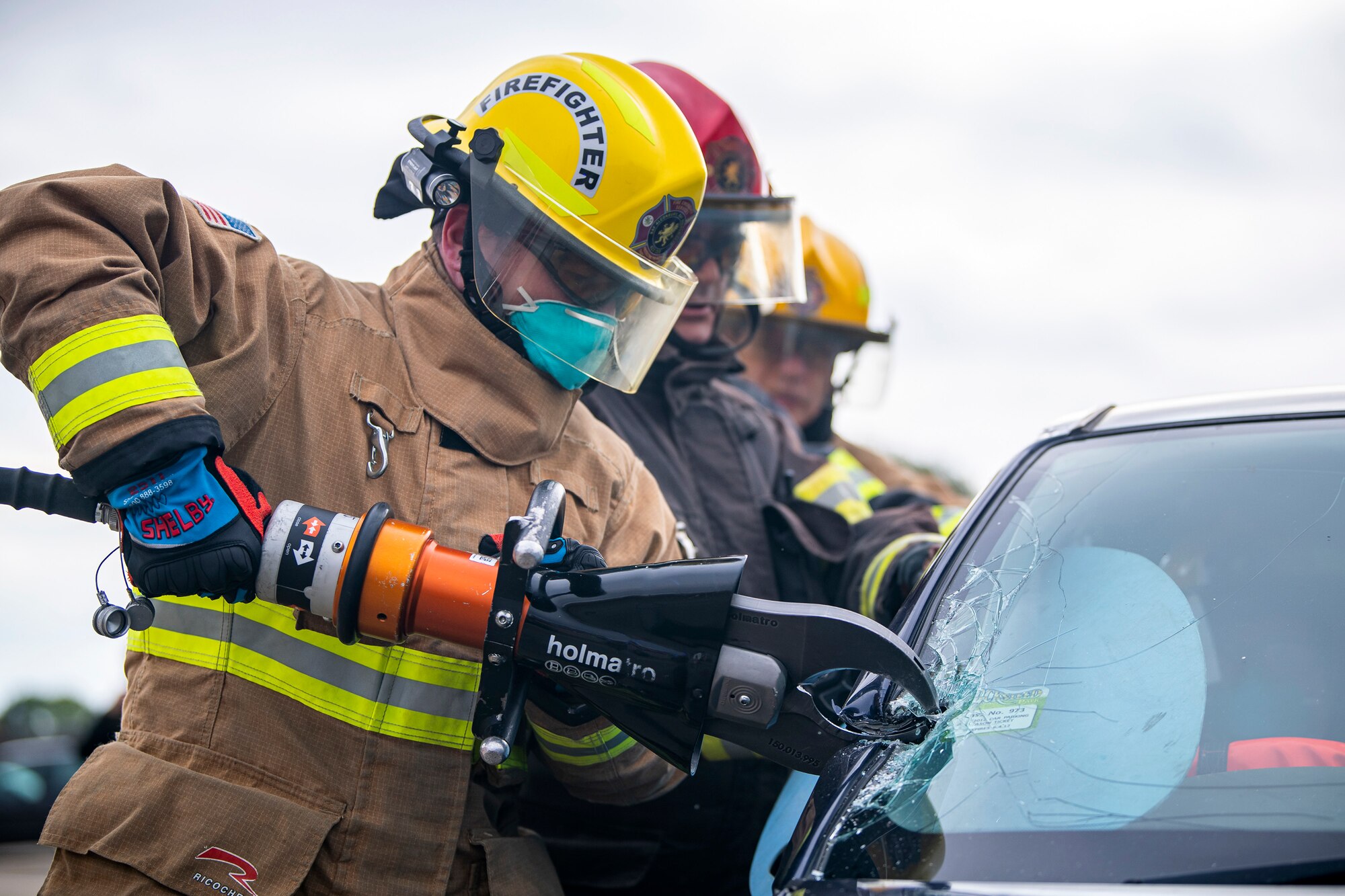 A firefighter from the 423d Civil Engineer Squadron, uses shears to dismantle a vehicle during a rescue demonstration at RAF Alconbury, England, Oct. 12, 2022. The demonstration was part of Fire Prevention Week in which firefighters from the 423d CES educated Airmen and dependents on proper fire safety habits. (U.S. Air Force photo by Staff Sgt. Eugene Oliver)