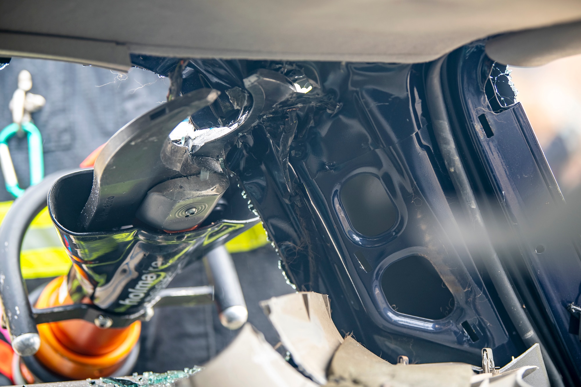 A firefighter from the 423d Civil Engineer Squadron, uses shears to dismantle a vehicle during a rescue demonstration at RAF Alconbury, England, Oct. 12, 2022. The demonstration was part of Fire Prevention Week in which firefighters from the 423d CES educated Airmen and dependents on proper fire safety habits. (U.S. Air Force photo by Staff Sgt. Eugene Oliver)