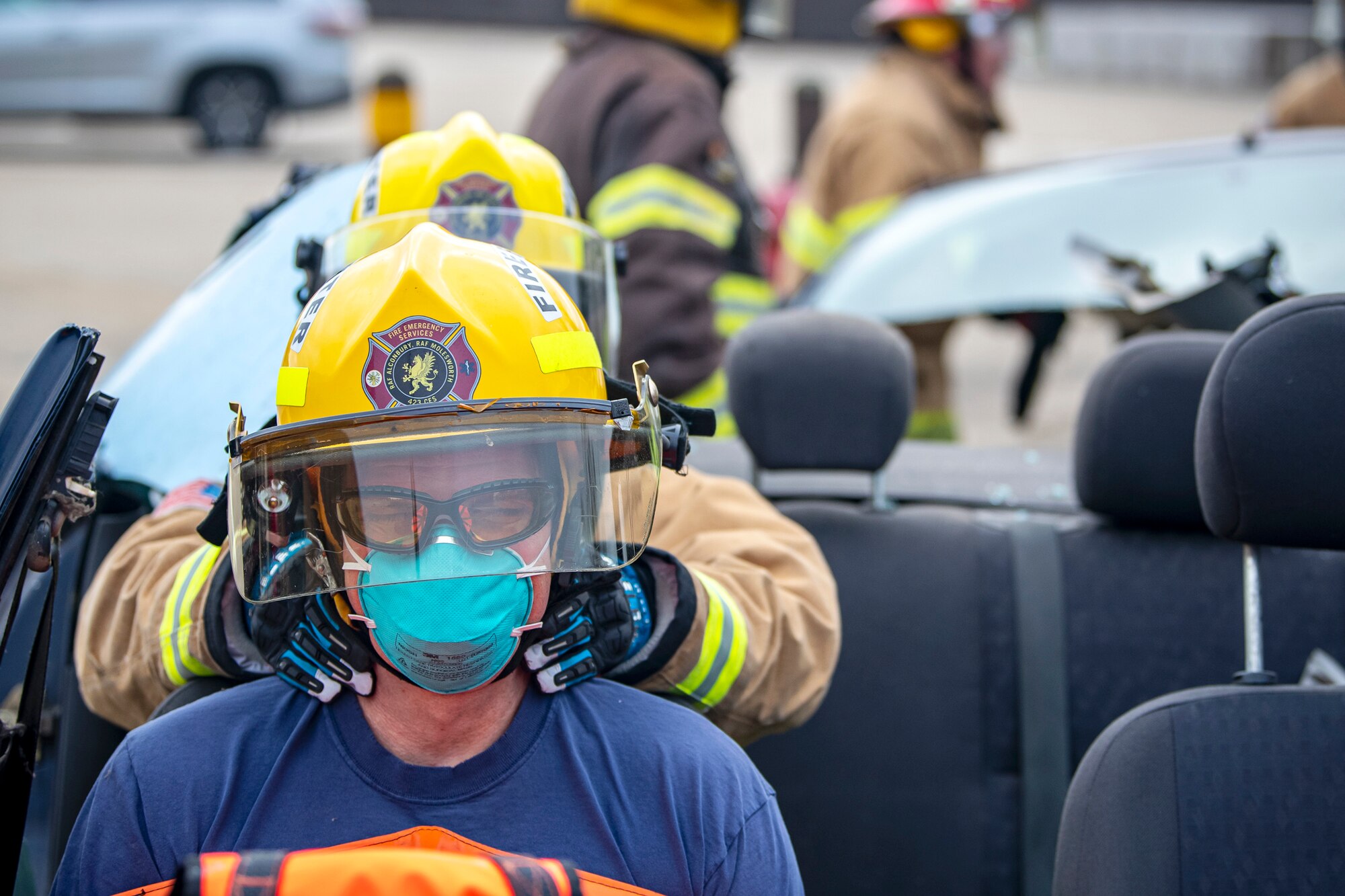 Firefighters from the 423d Civil Engineer Squadron, lift the upper section of a vehicle during a rescue demonstration at RAF Alconbury, England, Oct. 12, 2022. The demonstration was part of Fire Prevention Week in which firefighters from the 423d CES educated Airmen and dependents on proper fire safety habits. (U.S. Air Force photo by Staff Sgt. Eugene Oliver)