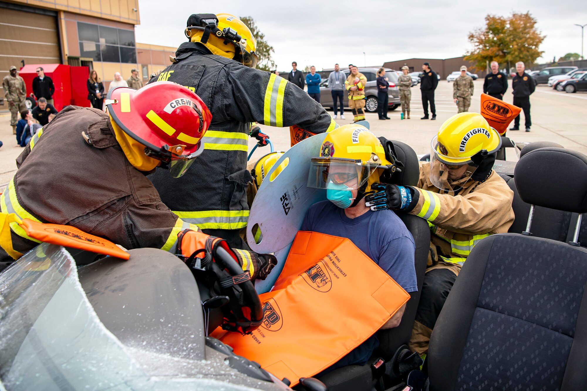 Firefighters from the 423d Civil Engineer Squadron, attempt to remove a simulated victim during a rescue demonstration at RAF Alconbury, England, Oct. 12, 2022. The demonstration was part of Fire Prevention Week in which firefighters from the 423d CES educated Airmen and dependents on proper fire safety habits. (U.S. Air Force photo by Staff Sgt. Eugene Oliver)