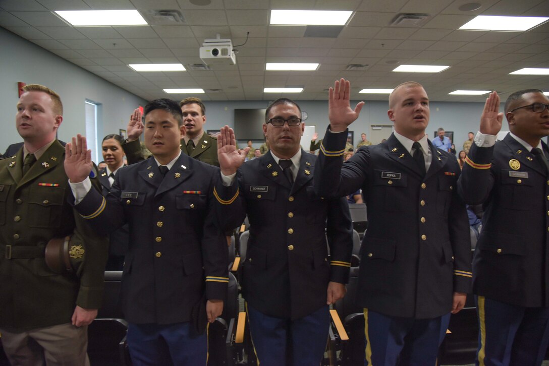 Eighteen officer candidates enrolled in the Virginia Army National Guard’s Officer Candidate School traditional and accelerated program celebrate their OCS graduation Sept. 18, 2022 at a ceremony held at Fort Pickett’s 183rdRegiment, Regional Training Institute in front of family, friends, fellow Soldiers and leaders. The graduation included candidates from OCS Class 64, as well as 65A and 65B. Retired Col. Fred Bolton served as the guest speaker for the event and Lt. Col. Eric Quinn administered the oath of office to the new lieutenants. The Troutville-based 29th Division Band provided ceremonial music for the occasion. (U.S. Army National Guard photo by Staff Sgt. Lisa M. Sadler)