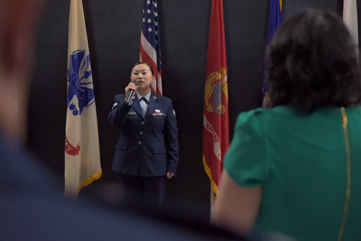 U.S. Air Force Senior Airman Cheyenne Her, Airman Leadership School class 22-G class leader, sings the national anthem during the graduation of ALS class 22-G, Goodfellow Air Force Base, Texas, Oct. 13, 2022. Graduates lead the ceremony in multiple military traditions, such as the singing of the national anthem and the Air Force song, and the Airman’s Creed. (U.S. Air Force photo by Senior Airman Michael Bowman)