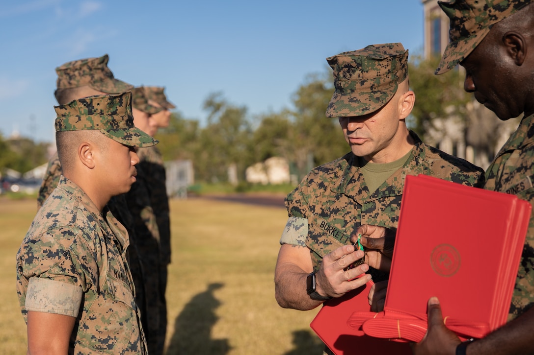 U.S. Marine Cpl. Vincent J. Mangle, an administrative clerk with Headquarters Battalion, Marine Forces Reserve, is awarded a Navy and Marine Corps Achievement Medal during a promotion and awards ceremony at Marine Corps Support Facility New Orleans, Oct. 3, 2022. Mangle was presented with a NAM for the numerous hours of volunteer work he dedicated towards the Toys for Tots program. (U.S. Marine Corps photo by Lance Cpl. Jennifer Delacruz)