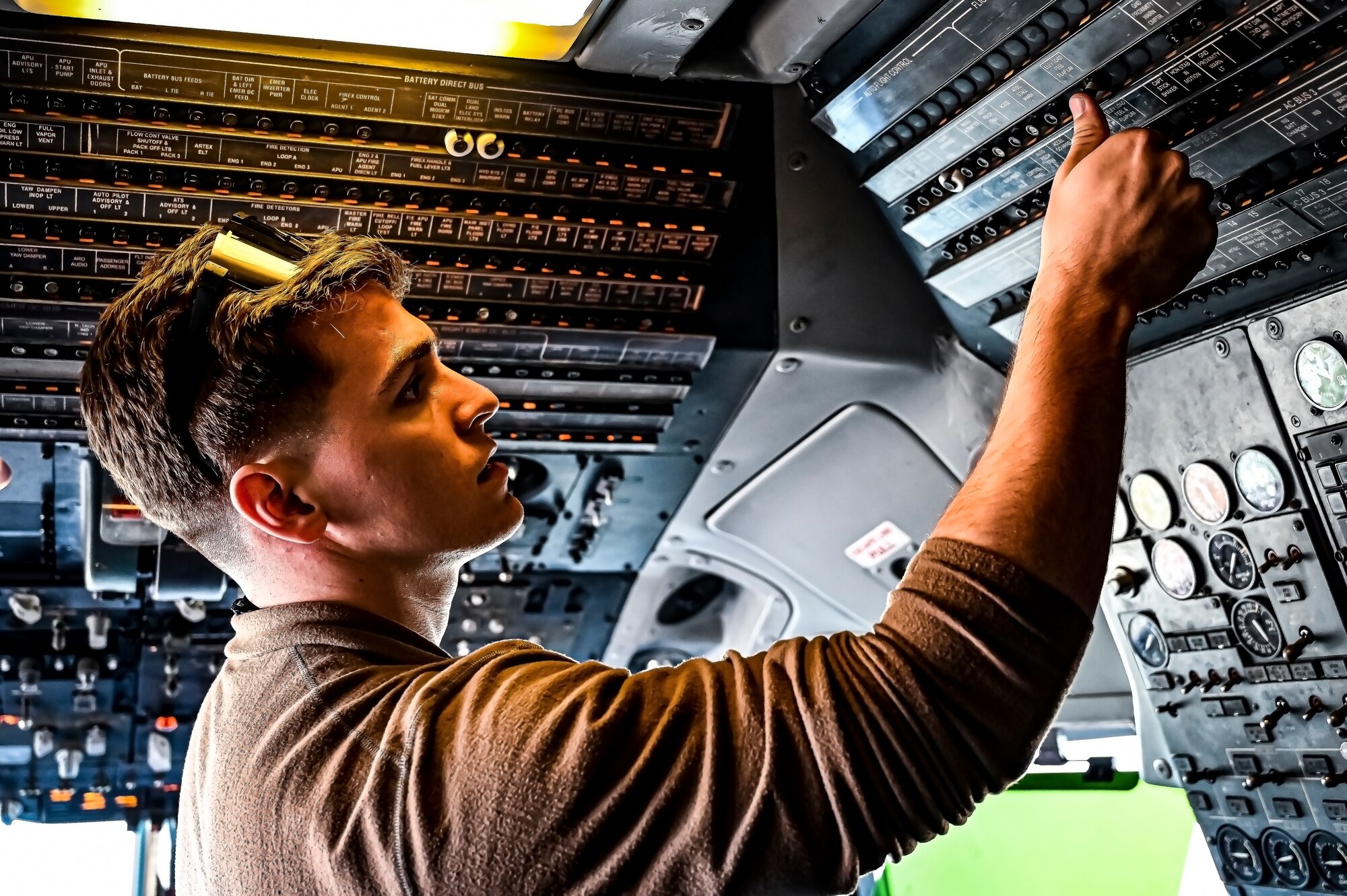 U.S. Air Force Senior Airman Austin Sondergard, 605th Aircraft Maintenance Squadron crew chief, performs pre-flight checks on a KC-10 extender at Joint Base McGuire-Dix-Lakehurst, N.J. on Oct. 10, 2022. Sondergard received brain surgery to remove an arteriovenous malformation, and later suffered losses to both memory, speech, and motor skills due to a stroke. Recovered, Sondergard returned to his duties as a Crew Chief and hobby as an avid powerlifter.