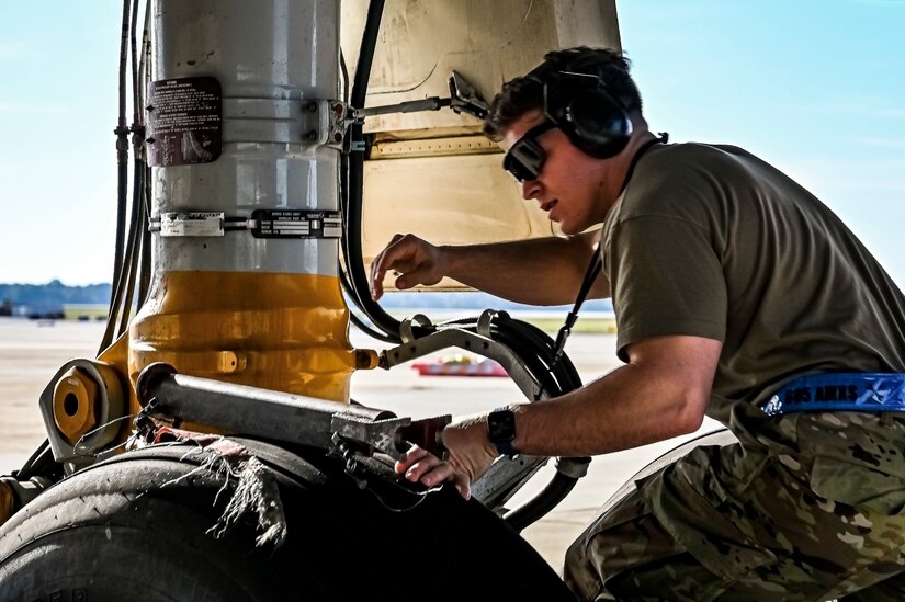 U.S. Air Force Senior Airman Austin Sondergard, 605th Aircraft Maintenance Squadron crew chief, performs pre-flight checks on a KC-10 extender at Joint Base McGuire-Dix-Lakehurst, N.J. on Oct. 10, 2022. Sondergard received brain surgery to remove an arteriovenous malformation, and later suffered losses to both memory, speech, and motor skills due to a stroke. Recovered, Sondergard returned to his duties as a Crew Chief and hobby as an avid powerlifter.