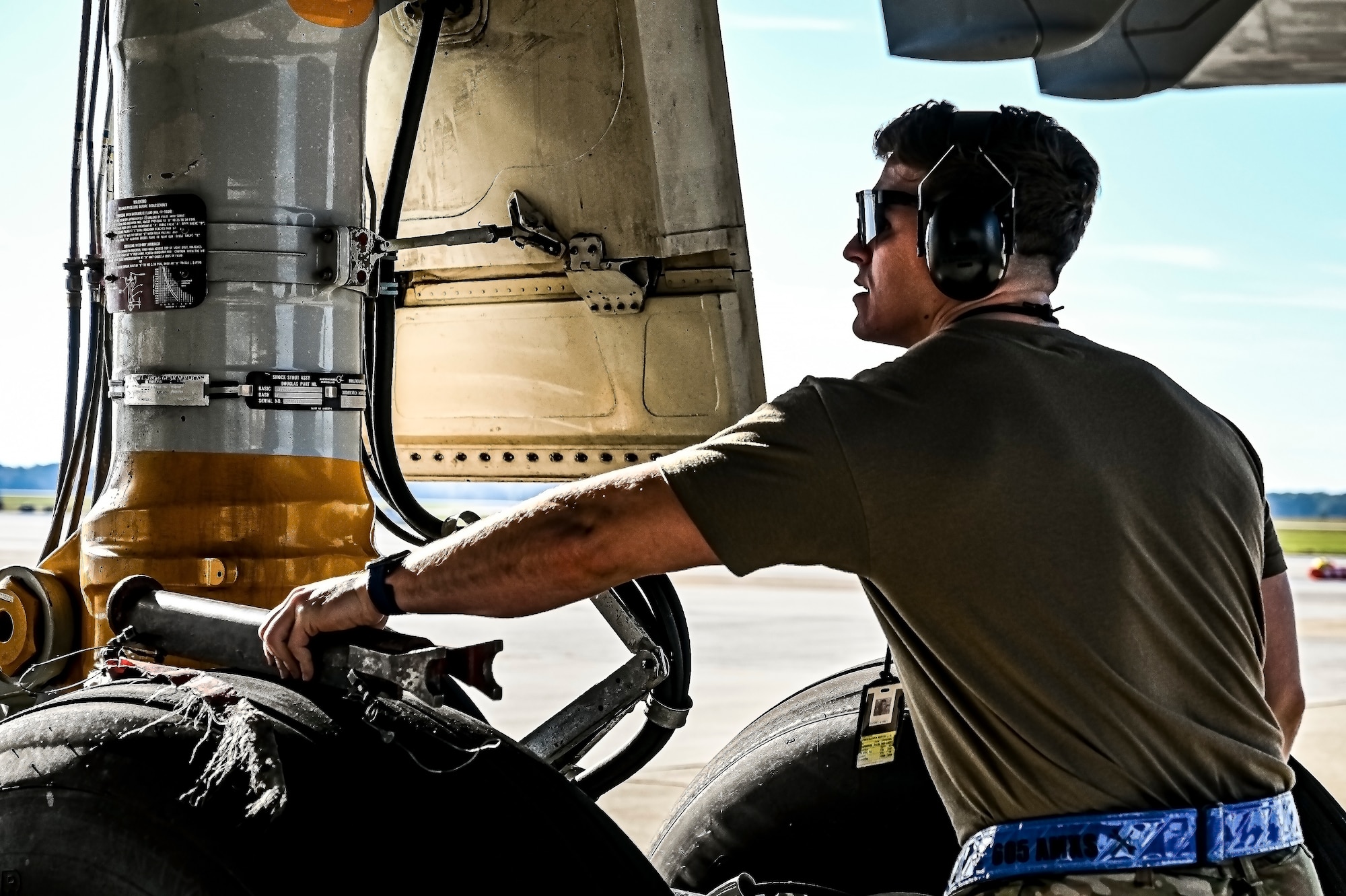 U.S. Air Force Senior Airman Austin Sondergard, 605th Aircraft Maintenance Squadron crew chief, performs pre-flight checks on a KC-10 extender at Joint Base McGuire-Dix-Lakehurst, N.J. on Oct. 10, 2022. Sondergard received brain surgery to remove an arteriovenous malformation, and later suffered losses to both memory, speech, and motor skills due to a stroke. Recovered, Sondergard returned to his duties as a Crew Chief and hobby as an avid powerlifter.