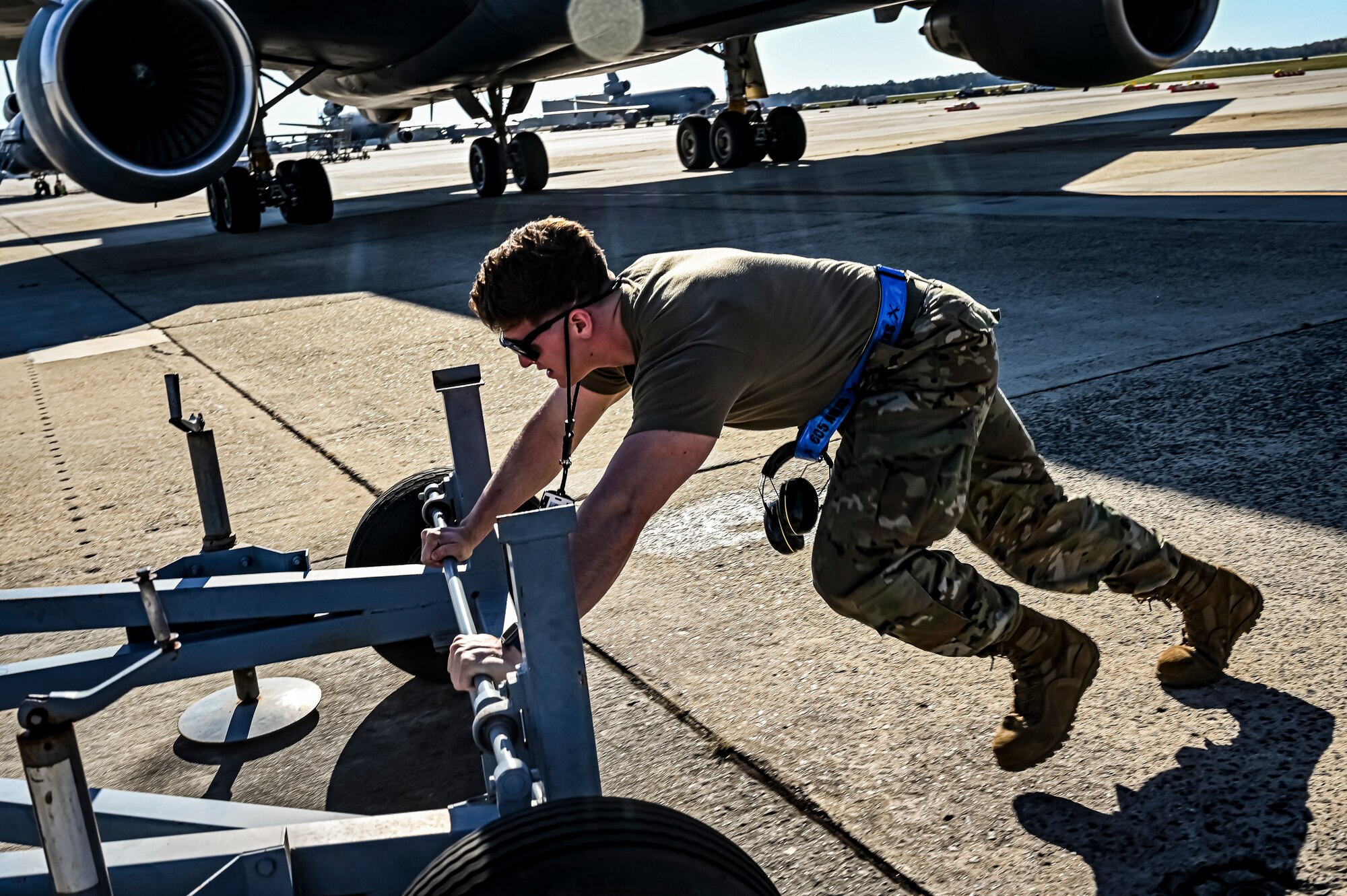 U.S. Air Force Senior Airman Austin Sondergard, 605th Aircraft Maintenance Squadron crew chief, performs pre-flight checks on a KC-10 extender at Joint Base McGuire-Dix-Lakehurst, N.J. on Oct. 10, 2022. Sondergard received brain surgery to remove an arteriovenous malformation, and later suffered losses to both memory, speech, and motor skills due to a stroke. Recovered, Sondergard returned to his duties as a Crew Chief and hobby as an avid powerlifter.