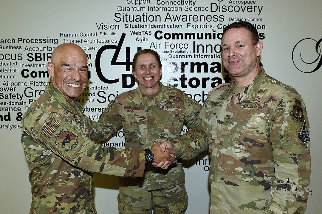 From left: Lt. Col. Diego Uribe, 152nd Air Operations Group; Brig. Gen. Denise Donnell, New York Air National Guard; and Col. Fred Garcia, Air Force Research Laboratory Information Directorate, celebrate the partnership between their organizations in Rome, New York, Oct. 5, 2022. The new partnership between AFRL and the 152nd AOG will support U.S. Air Force Air Combat Command needs with state-of-the-art machine-intelligence research and enhanced command and control capabilities. (U.S. Air Force photo / Albert Santacroce)