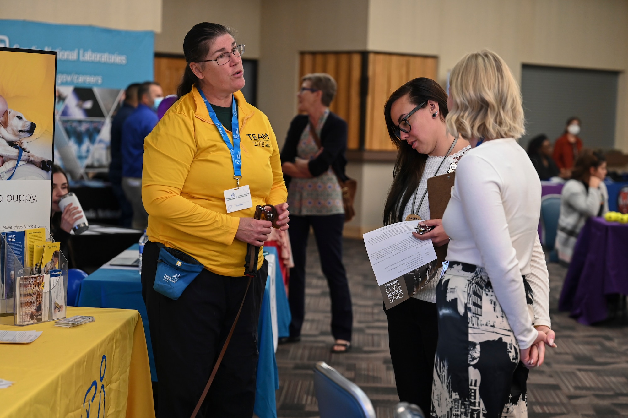 A group of women discuss helping agencies.