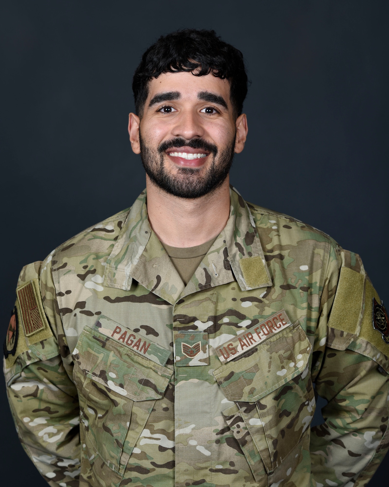 Air Force Staff Sgt. Gianfranco Pagan poses for a portrait photo.