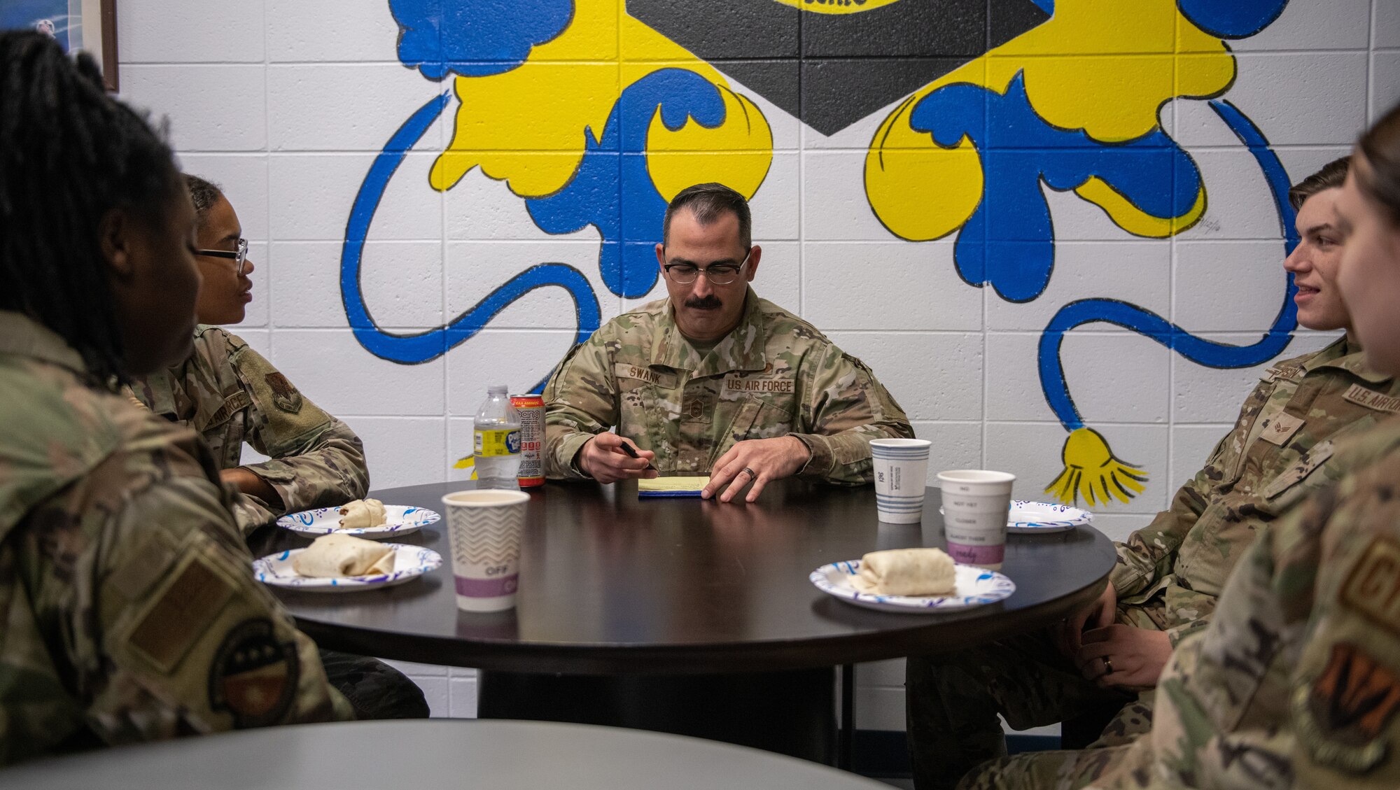 Airmen talk with each other