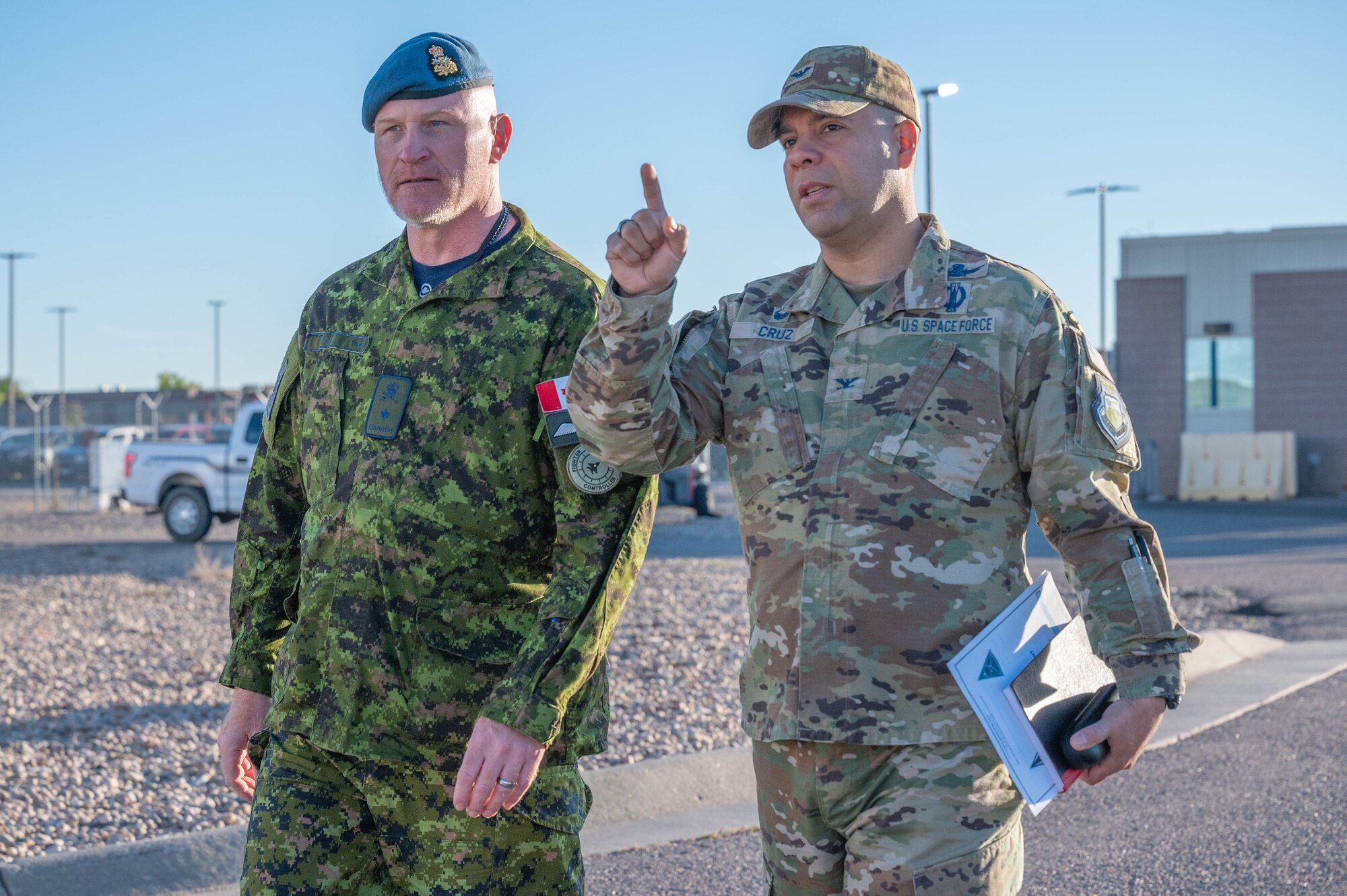 From left to right, Brig. Gen. Kyle Paul, Deputy Commanding General, Transformation, Space Operations Command, walks with Col. Miguel Cruz, Space Delta 4 commander, on their way to a mission brief at Buckley Space Force Base, Colo., Oct. 11, 2022. Paul is responsible for leading change within Headquarters Space Operations Command with a focus on data standards, policy, digital transformation, astrodynamics, military partnerships and international affairs, and innovation. (U.S. Space Force photo by Airman 1st Class Shaun Combs)