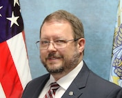 Biography portrait of Allen Naugle.