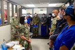 SAN DIEGO (Oct. 12, 2022) Capt. Kim Davis, Navy Medicine Readiness and Training Command San Diego’s commanding officer (center), speaks with NMRTC San Diego Sterile Processing Department Sailors during a Sterile Processing Week celebration at the hospital. NMRTC San Diego celebrates Sterile Processing Week to recognize the important role its specialists working in the Sterile Processing Department hold in patient care. NMRTC San Diego's mission is to prepare service members to deploy in support of operational forces, deliver high quality healthcare services and shape the future of military medicine through education, training and research. NMRTC San Diego employs more than 6,000 active duty military personnel, civilians and contractors in Southern California to provide patients with world-class care anytime, anywhere. (U.S. Navy photo by Mass Communication Specialist 3rd Class Raphael McCorey)