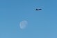 F-22 Raptor in sky with moon