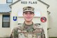 Airman 1st Class Alanis Ortiz in front of the Red Flag building