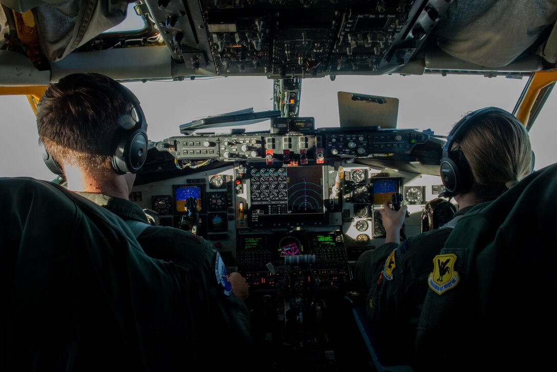 Maj. Rob Gruenenfelder and Capt. Elizabeth Luke fly a KC-135 Stratotanker
