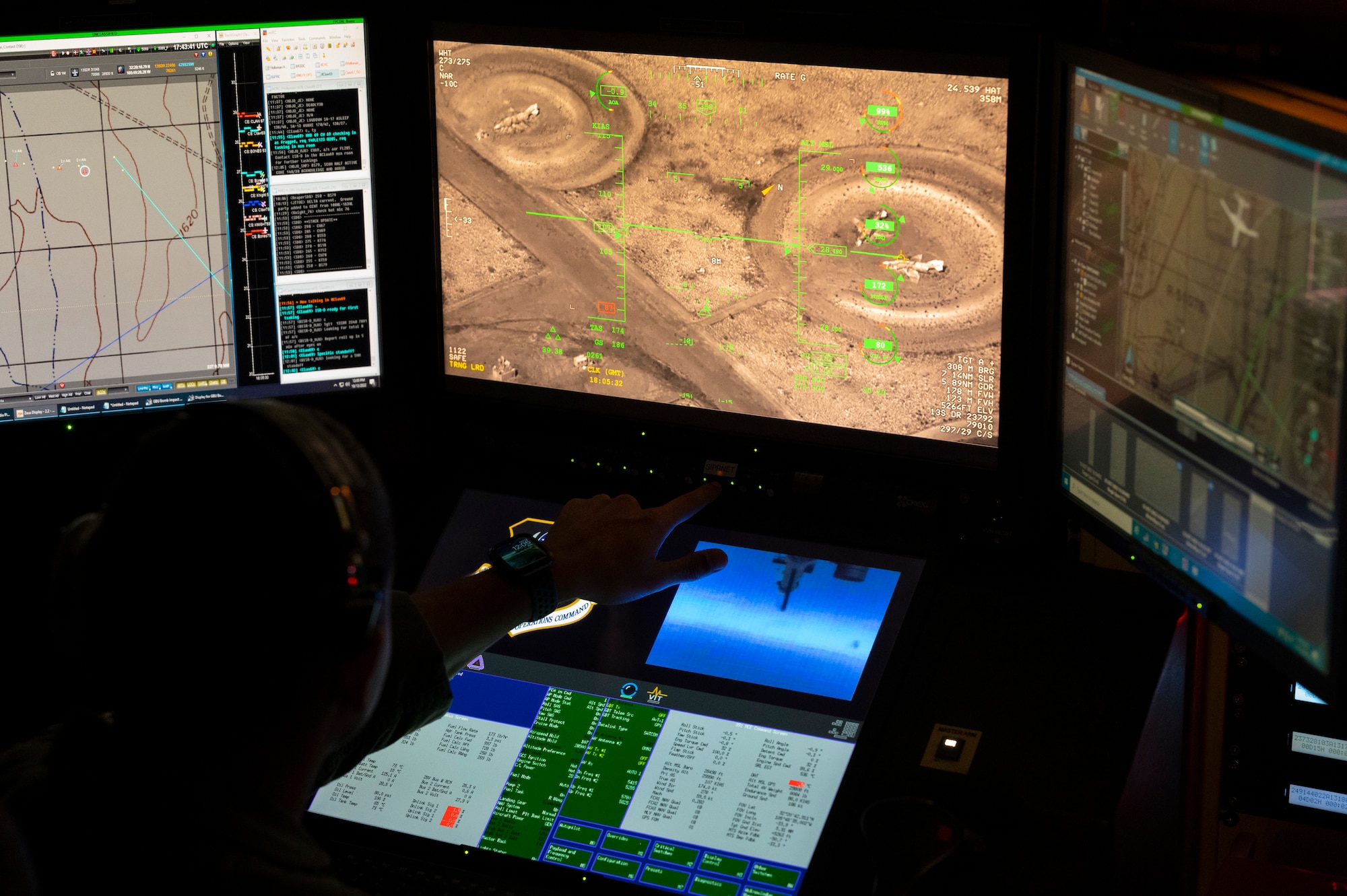 U.S. Air Force 2nd Lt. Cristino Garcia, 6th Attack Squadron MQ-9 Reaper student pilot, operates an MQ-9 during a training flight in a ground control station, Holloman Air Force Base, New Mexico, Oct. 13, 2022. The training provides both the pilot and the sensor operator with experience tracking and locating ground targets. (U.S. Air Force photo by Airman 1st Class Isaiah Pedrazzini)