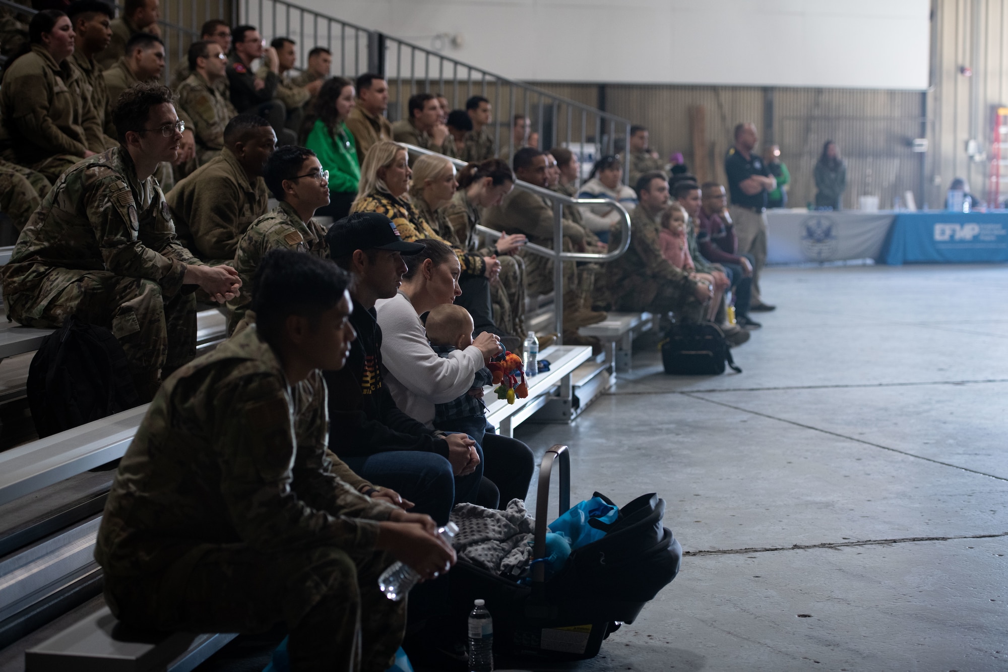 Airmen assigned to the 319th Reconnaissance Wing and their families attend the year end training initiative Oct. 7, 2022, at Grand Forks Air Force Base, North Dakota. The YETI is a mandatory briefing for all military members preparing for their first Grand Forks winter season. (U.S. Air Force photo by Senior Airman Phyllis Jimenez)