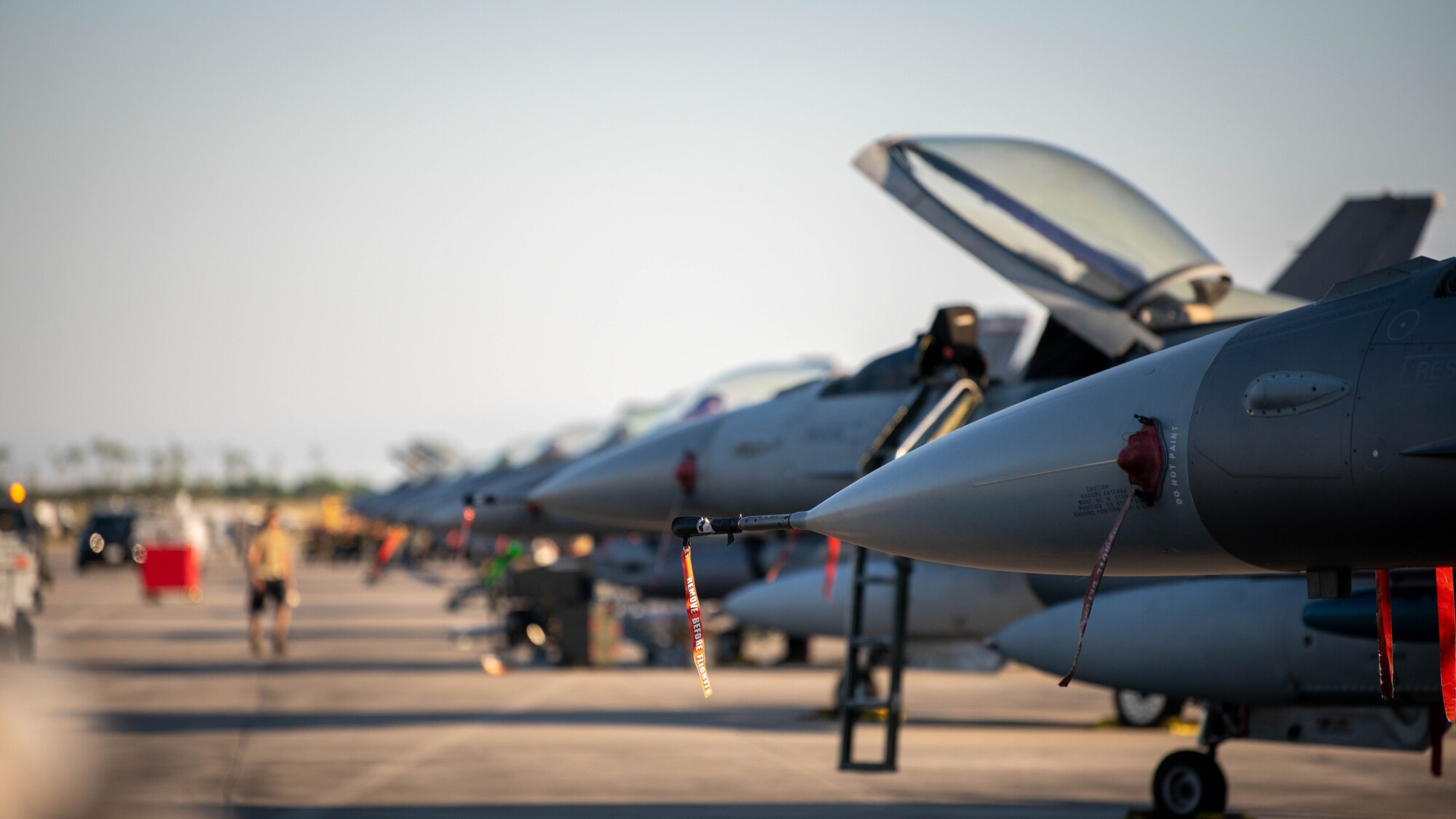Jets sit on a flight line.