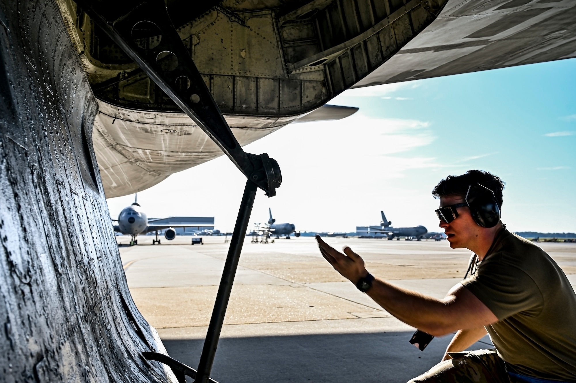 U.S. Air Force Senior Airman Austin Sondergard, 605th Aircraft Maintenance Squadron crew chief, performs pre-flight checks on a KC-10 extender at Joint Base McGuire-Dix-Lakehurst, N.J. on Oct. 10, 2022. Sondergard received brain surgery to remove an arteriovenous malformation, and later suffered losses to both memory, speech, and motor skills due to a stroke. Recovered, Sondergard returned to his duties as a Crew Chief and hobby as an avid powerlifter.