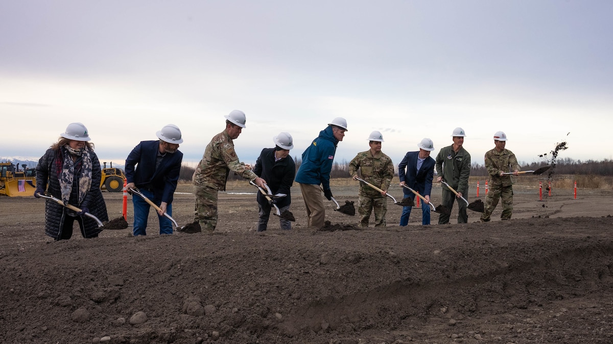 Col. David Wilson and Gov. Mike Dunleavy shovel dirt