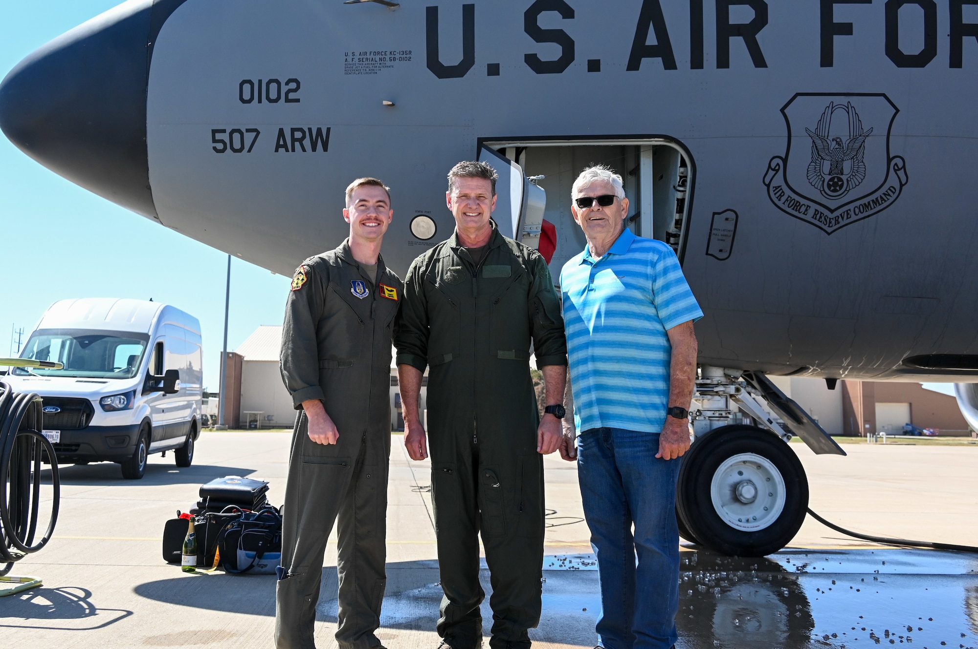 Col. Ken Humphrey, 507th Operations group commander, is joined by his son, 2nd Lt. Kennedy Humphrey, 71st Student Squadron student pilot, and his father, Retired Senior Master Sgt. Steve Humphrey, during his final flight as an 507th Air Refueling Wing Okie Sept. 29, 2022, Tinker Air Force Base, Oklahoma. 2nd Lt. Kennedy Humphrey will become a KC-135 pilot with the Okies at the conclusion of his pilot training. Kennedy will be the third generation in his family become an Okie. (U.S. Air Force photo by 2nd Lt. Mary Begy)