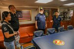 SATTAHIP, THAILAND (Oct. 10, 2022) Navy Counselor 1st Class Daniela Kobayashi, from Sinaloa, Mexico, speaks to members of Veterans of Foreign War (VFW) Post 9876, VFW Post 12146 and American Legion Post THO2 in the ward room aboard Arleigh Burke-class guided-missile destroyer USS Higgins (DDG 76) during a ship tour as Higgins conducts a scheduled port visit in Sattahip, Thailand, Oct. 10. Higgins is assigned to Commander, Task Force 71/Destroyer Squadron (DESRON) 15, the Navy’s largest forward-deployed DESRON and the U.S. 7th fleet’s principal surface force. (U.S. Navy photo by Mass Communication Specialist 1st Class Donavan K. Patubo)