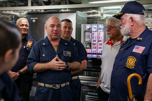 SATTAHIP, THAILAND (Oct. 10, 2022) Cmdr. Joseph McGettigan, commanding officer of Arleigh Burke-class guided-missile destroyer USS Higgins (DDG 76), speaks to members of Veterans of Foreign War (VFW) Post 9876, VFW Post 12146 and American Legion Post THO2  during a ship tour as Higgins conducts a scheduled port visit in Sattahip, Thailand, Oct. 10. Higgins is assigned to Commander, Task Force 71/Destroyer Squadron (DESRON) 15, the Navy’s largest forward-deployed DESRON and the U.S. 7th fleet’s principal surface force. (U.S. Navy photo by Mass Communication Specialist 1st Class Donavan K. Patubo)
