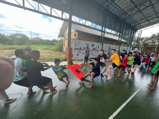 PATTAYA, Thailand (Oct. 8, 2022) Sailors from Arleigh Burke-class guided-missile destroyer USS Higgins (DDG 76) and Royal Canadian Navy (RCN) Halifax-class frigate HMCS Winnipeg (FFH 338) participate in a tug-of-war competition during a community relations event at the Child Development and Protection Center in Pattaya, Thailand during a port visit, Oct. 8. Higgins is assigned to Commander, Task Force 71/Destroyer Squadron (DESRON) 15, the Navy’s largest forward-deployed DESRON and the U.S. 7th fleet’s principal surface force. (U.S. Navy photo by Cryptologic Technician (Interpretive) 2nd Class Sabrina Agnewrossbauer)