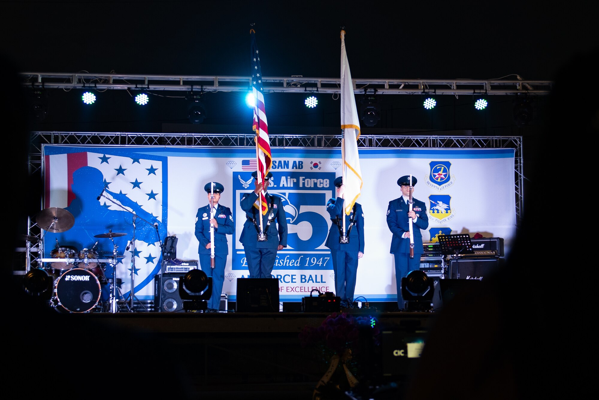 Osan and Kunsan Honor Guard members present the colors during the 75th Air Force Ball at Osan Air Base, Republic of Korea, Oct. 15th, 2022.
