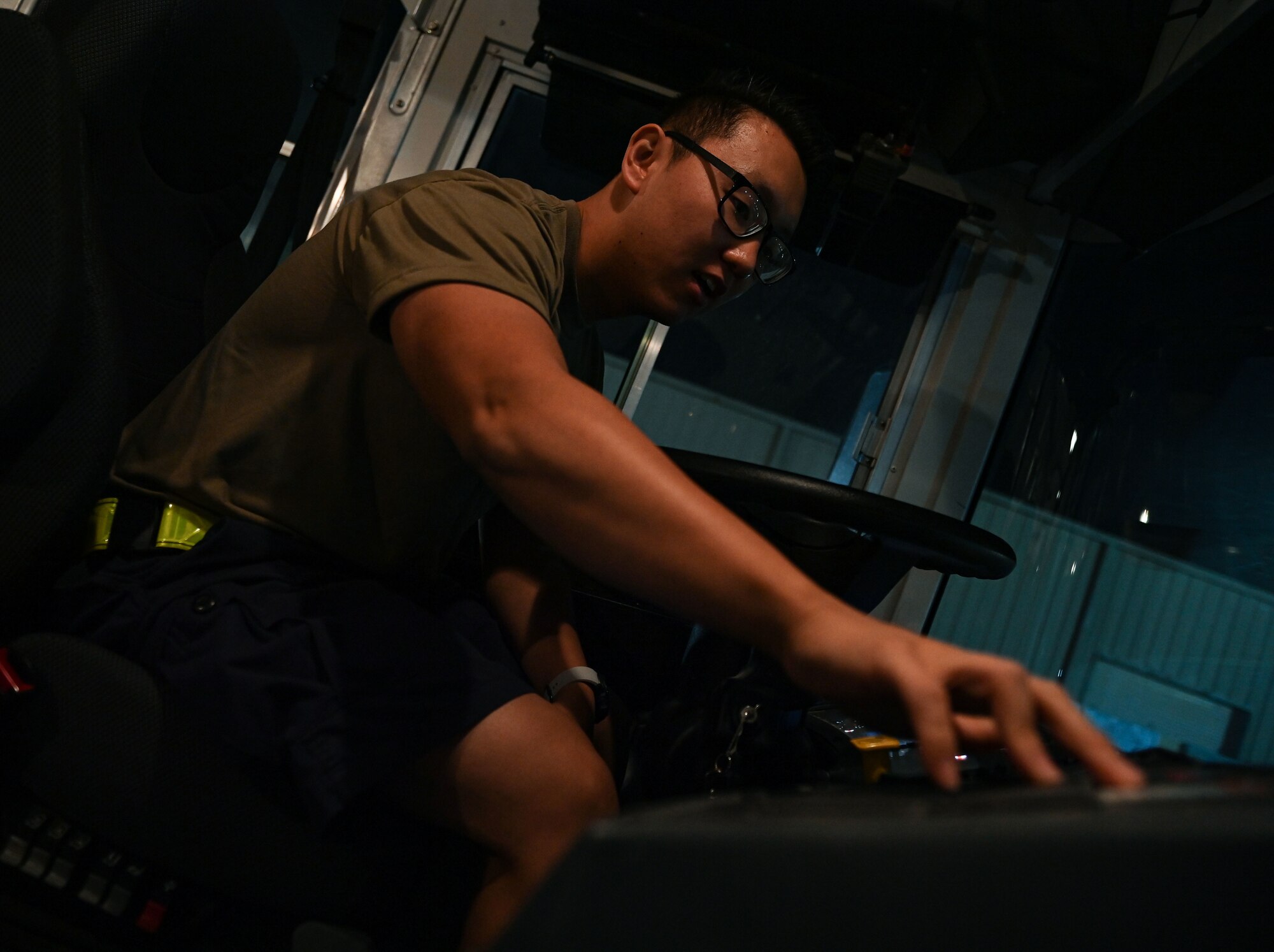 U.S. Air Force Senior Airman Tongil Lee, 379th Expeditionary Logistics Readiness Squadron ground transportation, prepares his shuttle for departure Oct. 3, 2022 at Al Udeid Air Base, Qatar. The base shuttle system makes 400 stops a day and helps AUAB members get to their destination. (U.S. Air National Guard photo by Master Sgt. Michael J. Kelly)