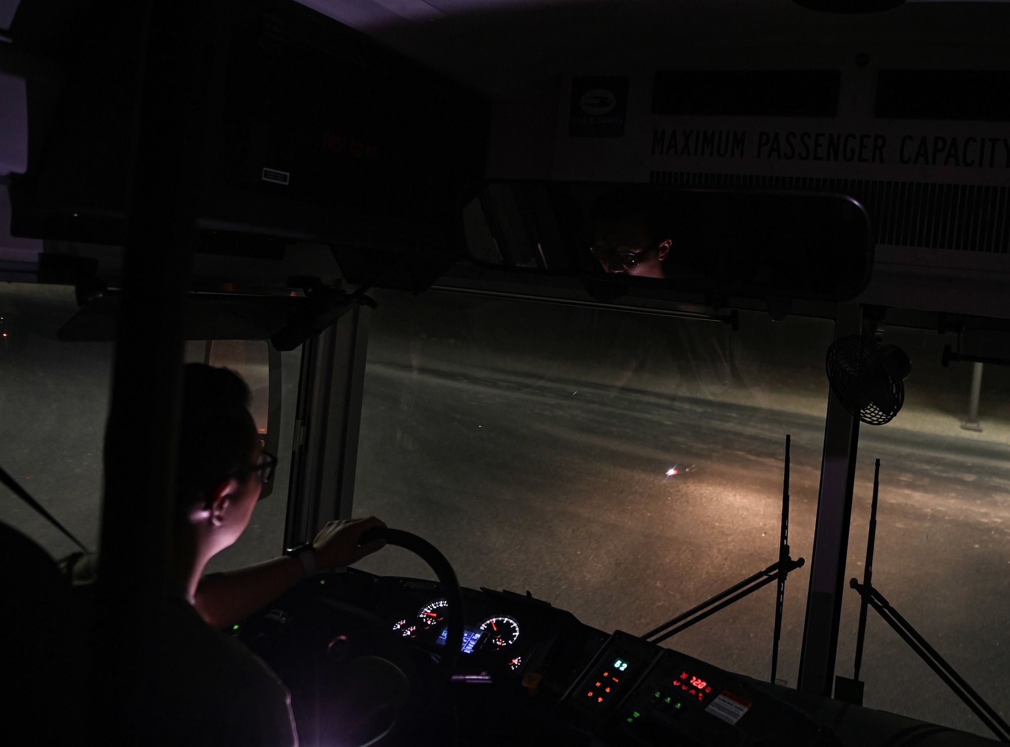 U.S. Air Force Senior Airman Tongil Lee, 379th Expeditionary Logistics Readiness Squadron ground transportation, cruises down his shuttle route Oct. 3, 2022 at Al Udeid Air Base, Qatar. The base shuttle system makes 400 stops a day and helps AUAB members get to their destination. (U.S. Air National Guard photo by Master Sgt. Michael J. Kelly)