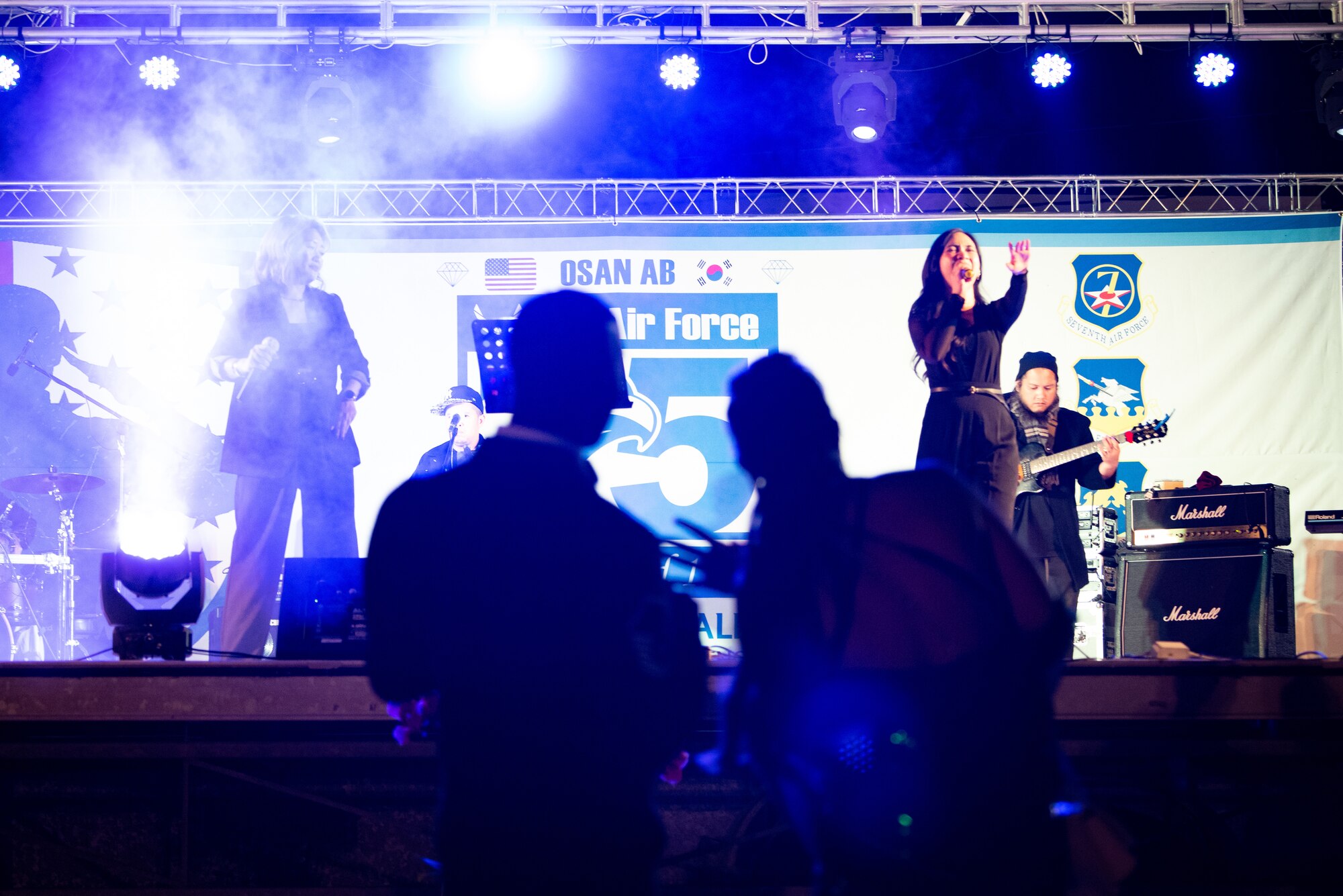 Attendees dance to a live performance by “Street Beat” during the 75th Air Force Ball at Osan Air Base, Republic of Korea, Oct. 15th, 2022.