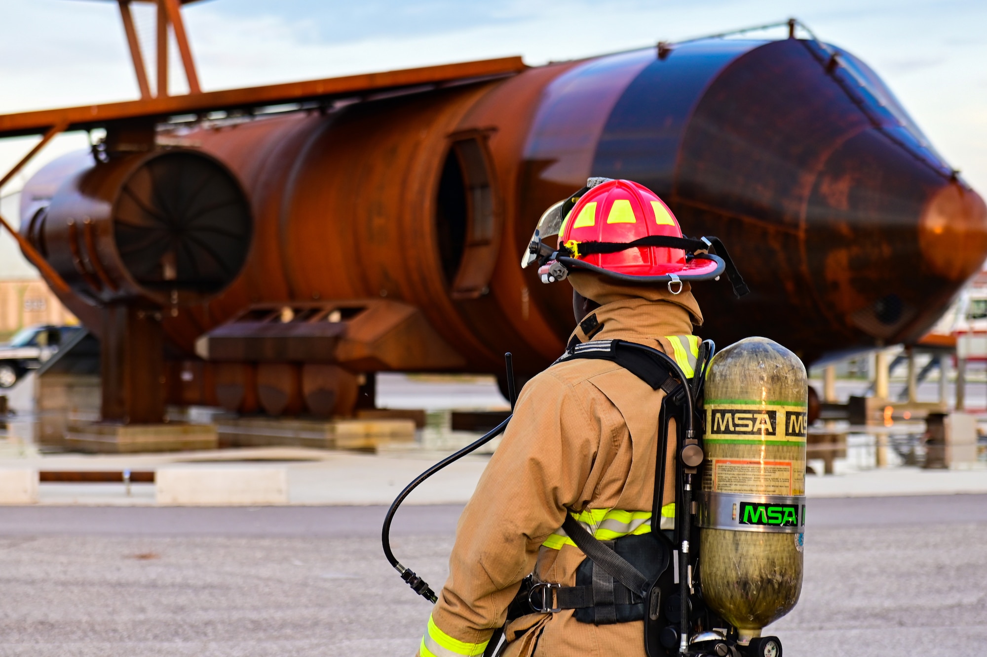 U.S. Air Force Staff Sgt. Bryant Goulsby, 31st Civil Engineer Squadron Firefighter, stands by prior to a live fire exercise at Aviano Air Base, Italy, Oct. 12, 2022. The live fire exercise was part of this year’s Fire Prevention Week. Fire Prevention Week is designed to inform people on how to stay safe in the event of a fire. (U.S. Air Force photo by Senior Airman Thomas S. Keisler IV)