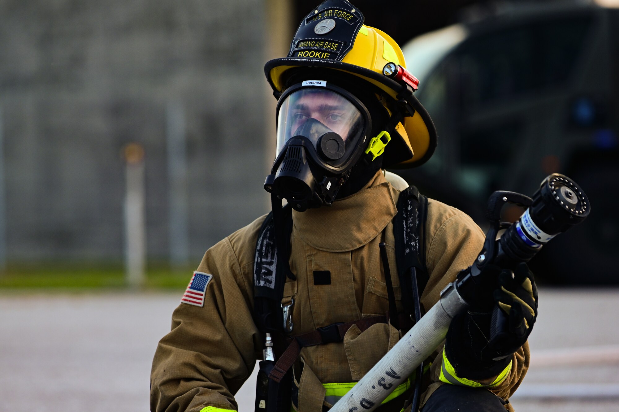 U.S. Air Force Senior Airman Giovanni Guercia, 31st Civil Engineer Squadron firefighter, waits for a live fire exercise to begin at Aviano Air Base, Italy, Oct. 12, 2022. The live fire exercise was performed to showcase Aviano AB capability to Airmen, families, and allies. (U.S. Air Force photo by Senior Airman Thomas S. Keisler IV)
