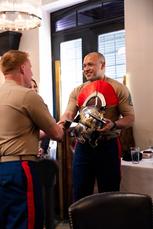 U.S. Marine Corps Major Michael M. Siani, Commanding Officer of Recruiting Station Dallas, awards Staff Sergeant Robert Simms the “Centurion” helm on Sept. 30, 2022 for his valiant efforts in Marine Corps Recruiting Command (MCRC). 



SSgt. Simms contracted 101 enlisted individuals into the Marine Corps as a canvassing recruiter of Recruiting Sub Station Mesquite. This achievement recongnizes him as a “Centurion” in the recruiting field and earned him a custom helm given to him by the Recruiting Station Dallas Command. (U.S. Marine Corps photo by Sgt. Webster Rison)