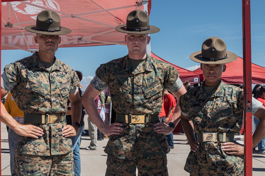 U.S. Marine Corps drill instructors with 12th Marine Corps District support a Battle Position recruitment set-up for the Marine Corps Air Station Miramar Air Show at MCAS Miramar, California, Sept. 23, 2022. Battle Position is the Corps' latest recruiting tool that incorporates virtual reality and challenges participants to earn the highest aggregate score of three events: pull-ups, ammo can lifts, and the pugil stick battle. (U.S. Marine Corps photo by Cpl. Emely Gonzalez)