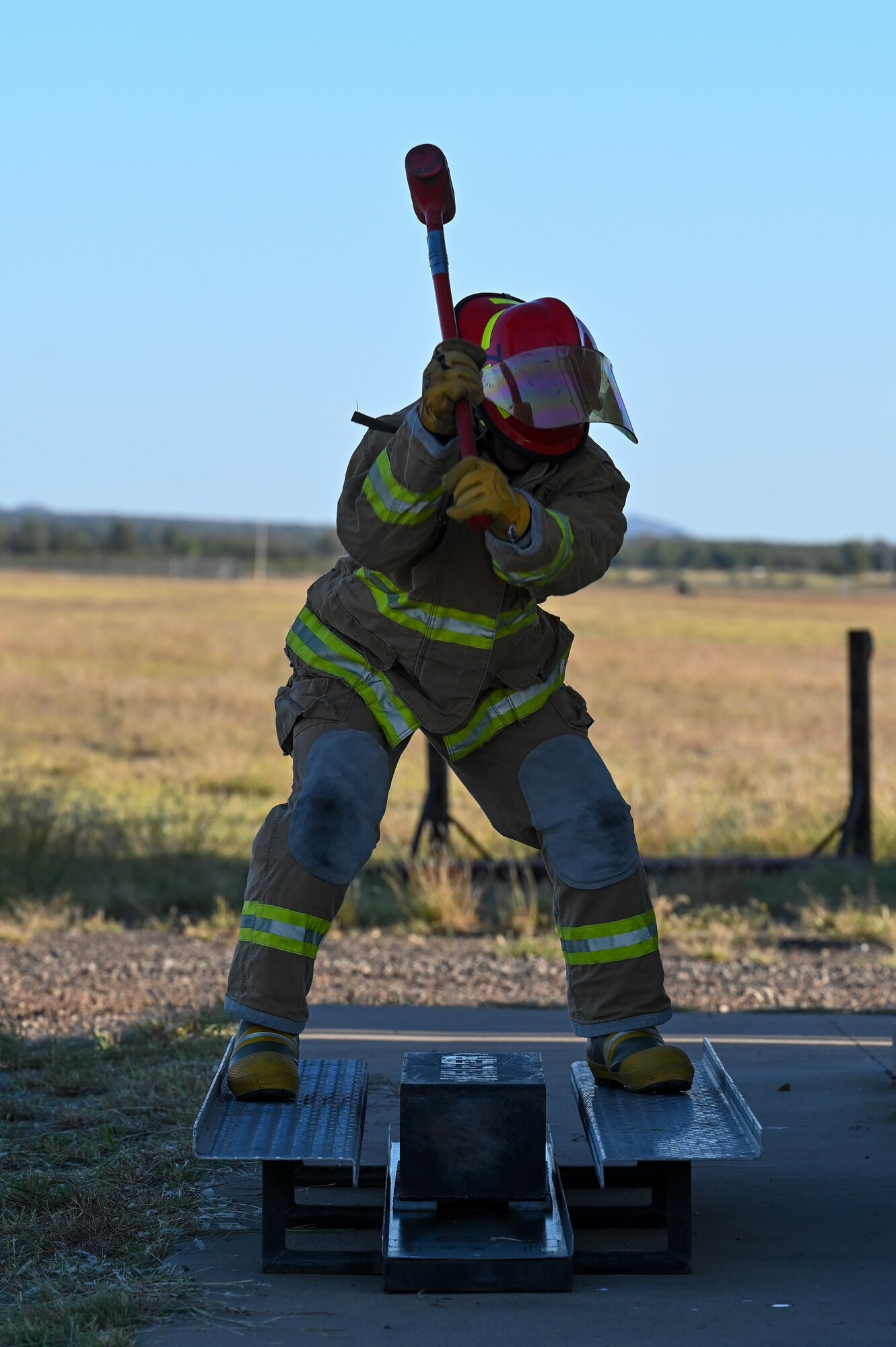 U.S. Air Force Lt. Col. Benjamin Davidson, 97th Training Squadron commander, participates in a challenge as part of Fire Prevention Week at Altus Air Force Base, Oklahoma, Oct. 13, 2022. The challenge included several obstacles to complete as quickly as possible to win the challenge against other commanders and first sergeants. (U.S. Air Force photo by Senior Airman Kayla Christenson)