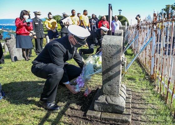 HAKODATE, Japan (Oct. 8, 2022) Arleigh Burke-class guided-missile destroyer USS Benfold (DDG 65) Command Master Chief Andrew Thomasson and Cmdr. Marcus Seeger, commanding officer of Benfold, lay flowers at the graves of two U.S. Navy Sailors buried at Hakodate Foreign General Cemetery during a community relations event in Hakodate, Japan, Oct. 8. Benfold is assigned to Commander, Task Force 71/Destroyer Squadron (DESRON) 15, the Navy’s largest forward-deployed DESRON and the U.S. 7th Fleet’s principal surface force. (U.S. Navy photo by Mass Communication Specialist 2nd Class Arthur Rosen)